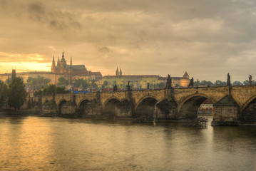 Fototapeta na wymiar View of Charles Bridge, Prague Castle and Vltava river in Prague, Czech Republic during sunset