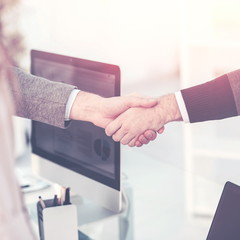 handshake between the client and the Manager of the company near the workplace