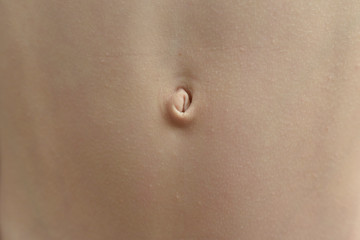 Navel of a white woman, seen from the front.
