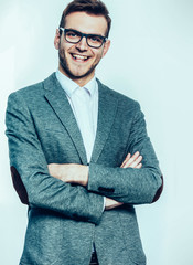 portrait of a successful Manager in glasses on a light backgroun