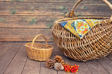 Fototapeta na wymiar Two wicker baskets small and large one. Hike for mushrooms in the forest. Autumn concept.