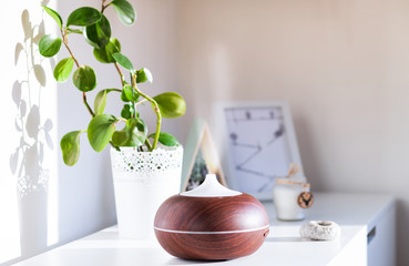 aroma oil diffuser on table at home. Air freshener