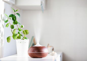aroma oil diffuser on table at home. Air freshener
