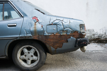 rusty old car, detail of peeling paint, close up full frame image