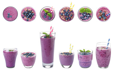 Glasses of delicious blueberry smoothie on white background