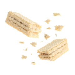 Delicious broken sweet wafer on white background