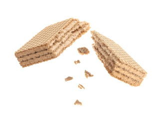 Delicious broken sweet wafer on white background