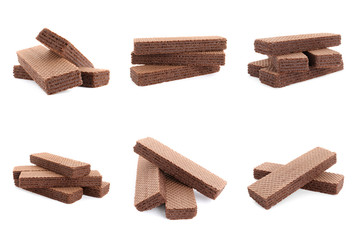 Set of delicious crispy wafers on white background