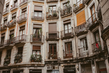 Fototapeta na wymiar windows and balconies of an apartment building in Barcelona, Spain