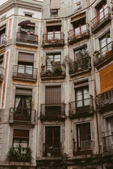 Obraz premium windows and balconies of an apartment building in Barcelona, Spain