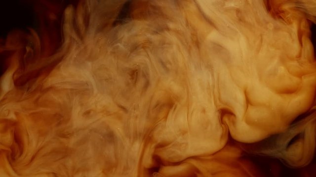 Super slow motion of pouring milk into coffee drink. Filmed on very high speed cinema camera