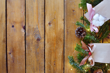 Christmas fir tree with decoration on dark wooden board
