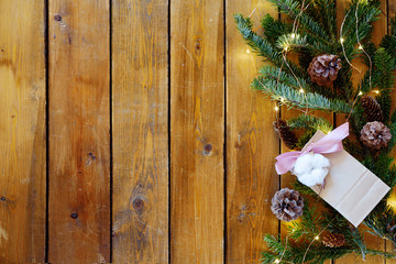 Christmas fir tree with decoration on dark wooden board