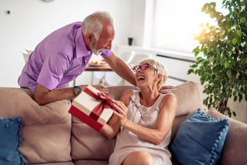 Senior couple celebrate at home