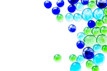 Glass stones for design and home creativity on white background top view space for text