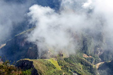 Landscape background with mountains in the clouds from the top of the Machu Piccu mountain