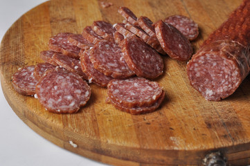 Sausage on a wooden board isolated on a white background.Food