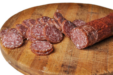 Sausage on a wooden board isolated on a white background.Food