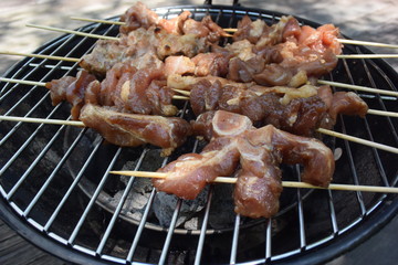 Raw pork skewer in bamboo stick