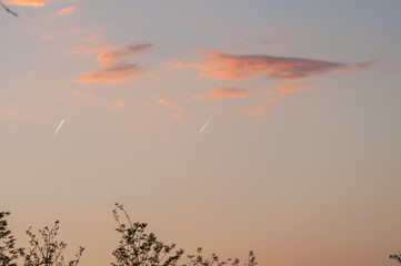 Airplane in the distance on a beautiful blue sky.