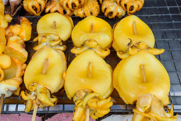 Grilled Squid at street food market in thailand