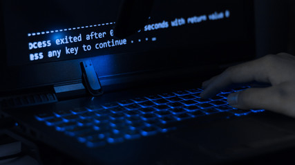 Computer programmers or hackers use usb to get information from their laptops to hack the corporate secret. © JaRiRiyawat