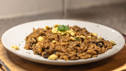 food of rissotto, parsely and egg