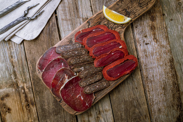slicing of different meat on the board