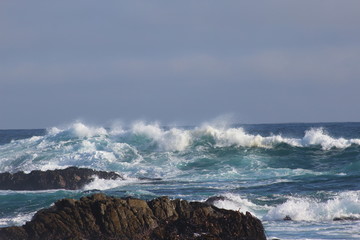 HIght waves in a windy day in a rocky beach