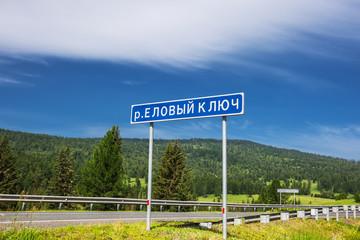 Fototapeta premium Road sign - river Spruce Key. Altai Republic, Russia