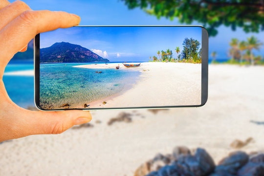tropical beach picture on smartphone - travel concept - travel blog
