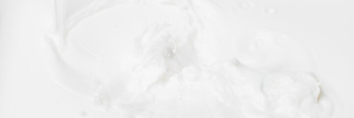 Obraz na płótnie Canvas White abstract liquid background for cosmetics. Cream white background texture for web banner. Natural milk abstract blurred web banner for beauty.