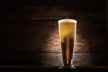 Glass beer on wood