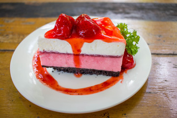 Strawberry Cake Dessert on wooden table  in cafe