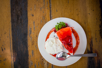 Strawberry Cake Dessert on wooden table  in cafe