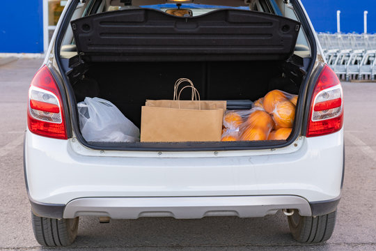 Opened Car Trunk With Bags With Food Purchased In Grocery Store