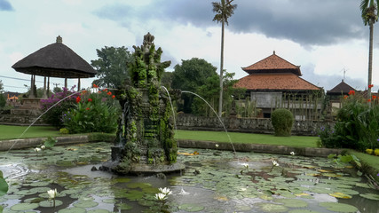 fountain in the gardens of taman ayun temple