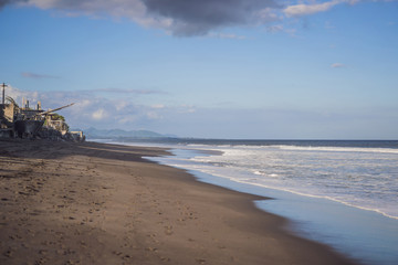 Fototapeta na wymiar Black sand on the beach Bali, Indonesia