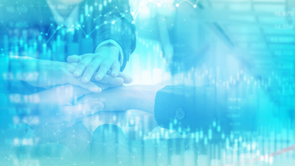 Business People teamwork stacking hands with trading background