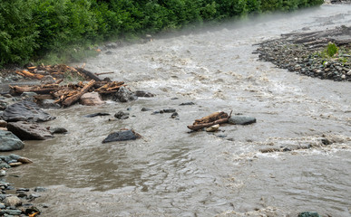 The powerful flow of a mountain river in the spring