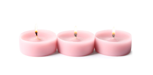 Fototapeta na wymiar Pink wax decorative candles isolated on white