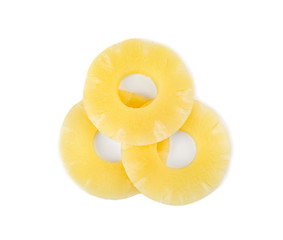 Slices of delicious sweet canned pineapple on white background, top view