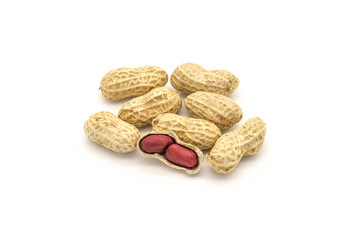 Close-up of a small pile of shelled peanuts on a white background