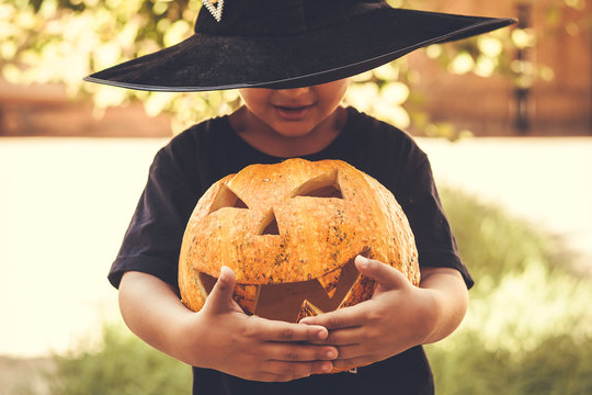 Boy holding halloween pumpkin