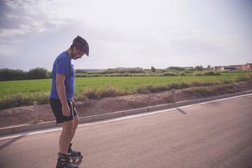 man with inline skates skating on the street