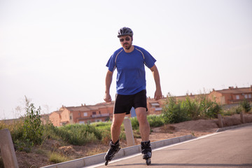 Fototapeta premium man with inline skates skating on the street
