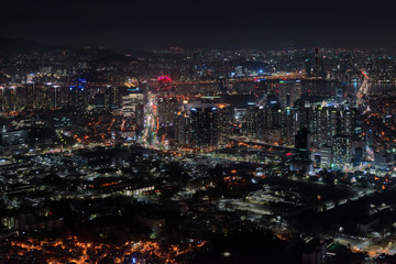 Obraz premium Aerial view of urban skyscrapersand central city at night, Seoul, South Korea.