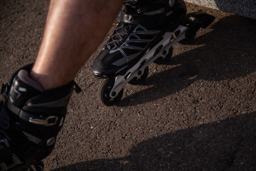 man with inline skates skating on the street