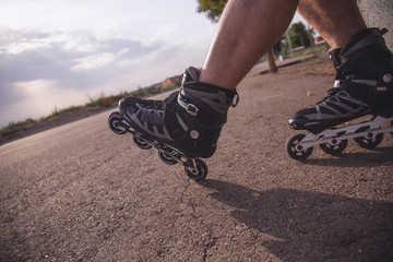 man with inline skates skating on the street
