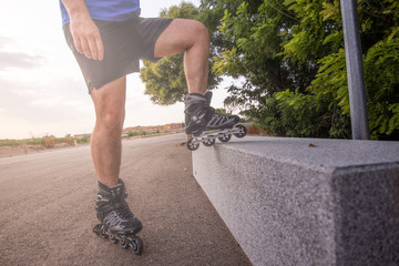 man with inline skates skating on the street